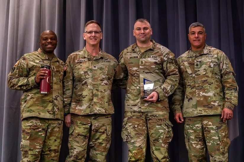 Sgt. 1st Class Denis Mulligan, third from left, Health Services and Support Branch Chief with the Pa. Guard’s G1 Services Division, was recently recognized as the Army National Guard medical readiness noncommissioned officer of the year for large states. The award is intended to recognize a medical readiness NCO who has demonstrated excellence in their position by contributing to high levels of medical readiness while serving. (U.S. Army National Guard courtesy photo)