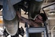 Senior Airman Nicholas Bowden, 69th Bomber Generation Squadron load crew member, secures an inert GBU-31 Joint Direct Attack Munition to a B-52H Stratofortress during the 1st Quarter Weapons Load Competition at Minot Air Force Base, May 2, 2025. Weapons load competitions play a significant role in enhancing mission readiness and strengthening global strike capabilities. (U.S. Air Force photo by Senior Airman Alyssa Bankston)
