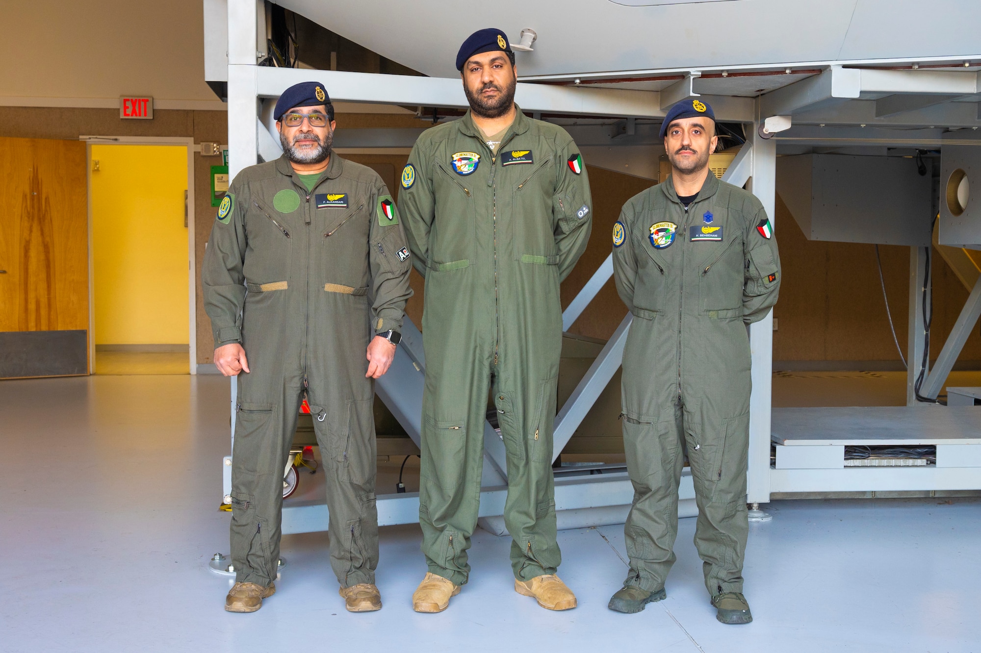 Kuwait Air Force Airmen stand together inside the 373rd Training Squadron, Detachment 12, building at Joint Base Lewis-McChord, Washington, April 24, 2025.
