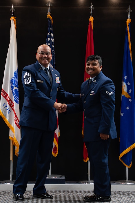 U.S. Air Force Airman 1st Class Nathaniel Graham, 17th Communications Squadron, is presented the Razorsharp award by Chief Master Sgt. Jason Ramon, 17th Mission Support Group senior enlisted leader, during the Goodfellow Base Honor Guard class 25-Alpha graduation ceremony at the Powell Event Center, Goodfellow Air Force Base, Texas, May 2, 2025. The Razorsharp award is presented to the ceremonial guardsman who displays outstanding performance and embodies the highest levels of respect, integrity, and precision during training. (U.S. Air Force photo by Airman 1st Class Brian Lummus)