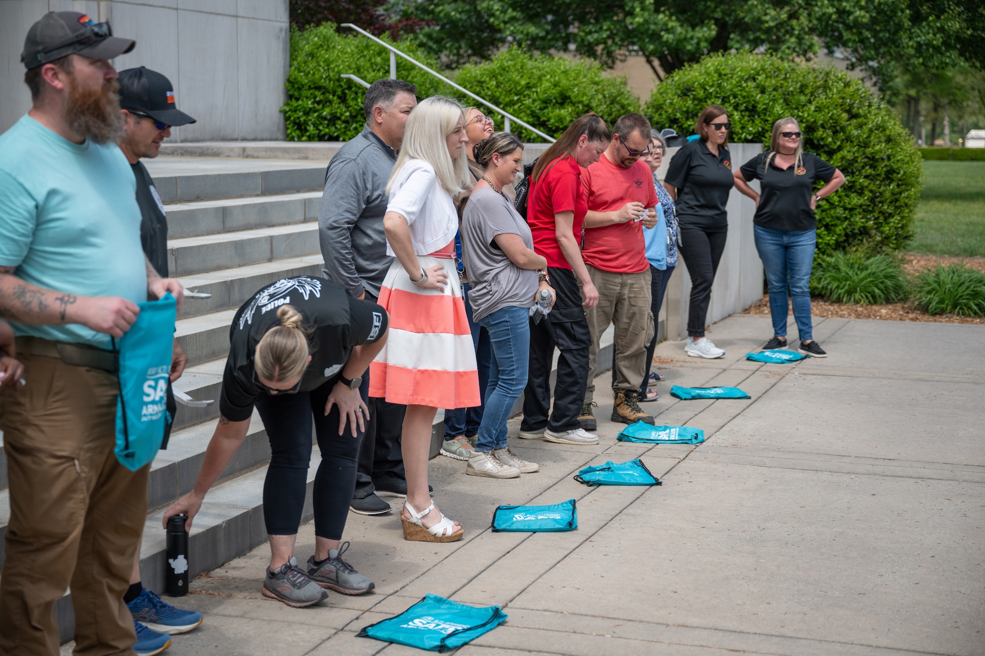 Arnold Air Force Base team members line up to begin the Arnold AFB Sexual Assault Prevention and Response Office Amazing Race event, April 23, 2025 at Arnold AFB, Tenn. The event was among several activities put on by the Arnold AFB SAPR throughout April to coincide with Sexual Assault Awareness and Prevention Month. (U.S. Air Force photo by Keith Thornburgh)
