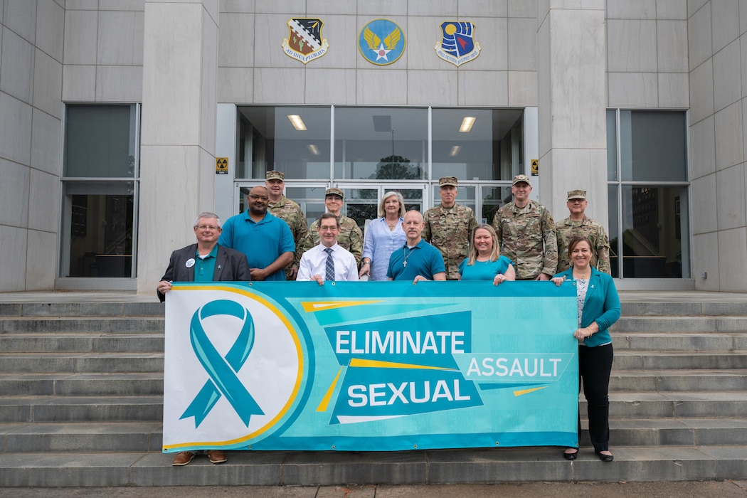 Arnold Engineering Development Complex leadership, members of the Integrated Prevention and Response Office team at Arnold Air Force Base, and the Arnold AFB Sexual Assault Prevention and Response team gather for a photo April 22, 2025, at Arnold AFB, Tenn. The Arnold AFB SAPR office held various events throughout April to coincide with SAAPM. Arnold AFB is the headquarters of AEDC. (U.S. Air Force photo by Keith Thornburgh)