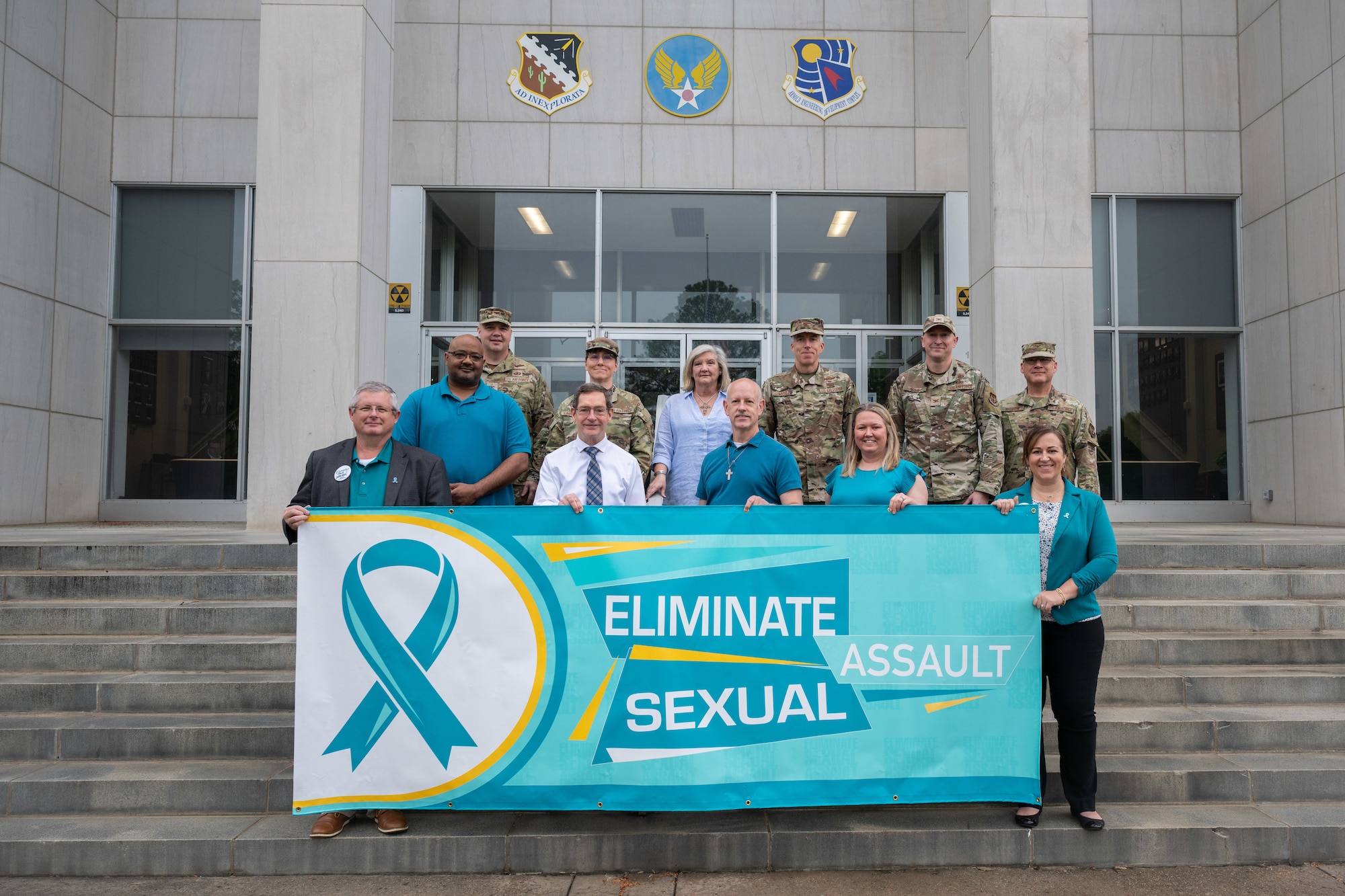 Arnold Engineering Development Complex leadership, members of the Integrated Prevention and Response Office team at Arnold Air Force Base, and the Arnold AFB Sexual Assault Prevention and Response team gather for a photo April 22, 2025, at Arnold AFB, Tenn. The Arnold AFB SAPR office held various events throughout April to coincide with SAAPM. Arnold AFB is the headquarters of AEDC. (U.S. Air Force photo by Keith Thornburgh)
