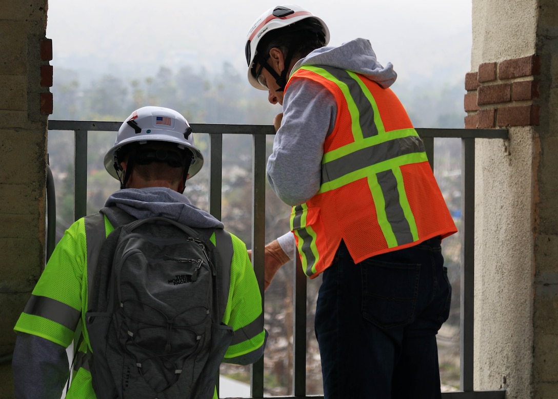 U.S. Army Corps of Engineers civil engineers (structural) John Fogarty and Ian Buchanan inspect the outer edges of the tower at the Eliot Arts Magnet Academy in Altadena, California. The surrounding buildings suffered extensive damage following the Southern California wildfires of January 2025, April 15.

USACE is working in partnership with local, state and the Federal Emergency Management Agency in response to the Southern California Wildfires