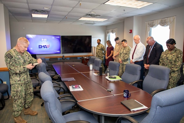 250506-N-KC192-1007 PORTSMOUTH, Va. (May 6, 2025) Capt. William Hlavin, the regional chaplain assigned to Naval Medical Forces Atlantic (NMFL), leads a prayer during a blessing of the hands ceremony held during National Nurses Week for NMFL nurses and staff as all are a part of the healing team onboard Naval Support Activity (NSA) Hampton Roads - Portsmouth Annex, May 6, 2025. Blessing of the hands is a moment of celebration and thanksgiving in recognition of a caregiver’s hands with oils or water and symbolizes how hands are used to deliver care and compassion. The Blessing of the Hands symbolizes the sacred role of healers and connects to Spiritual Readiness by affirming a caregiver’s sense of purpose, compassion, and inner strength to serve others with honor and resilience. (U.S. Navy photo by Mass Communication Specialist 2nd Class Levi Decker)