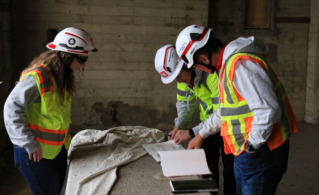Civil engineers (structural) (left to right) Kayla Stull Ian Buchanan, John Fogarty, and of the U.S. Army Corps of Engineers look over blueprints for the Eliot Arts Magnet Academy tower in Altadena, California as they ascend the tower to determine potential damage concerns following the Southern California wildfires of January 2025, April 15.

USACE is working in partnership with local, state and the Federal Emergency Management Agency in response to the Southern California Wildfires.