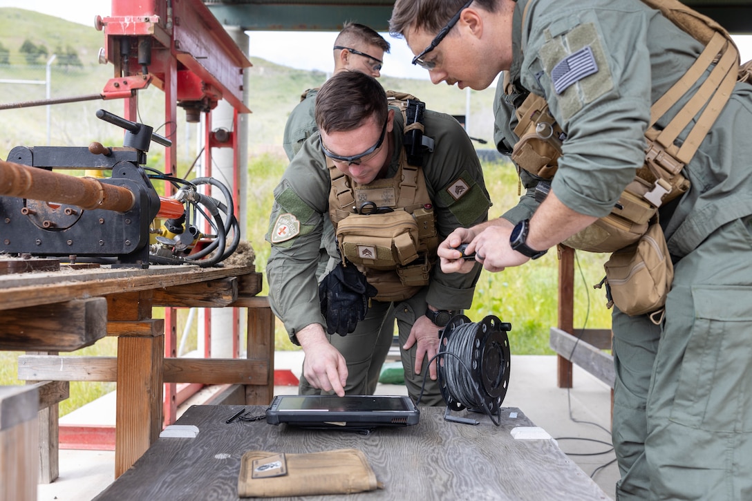 U.S. Marines with 7th Engineer Support Battalion, 1st Marine Logistics Group, inspect an x-ray of a grenade during an explosive ordnance disposal exploitation exercise, on Marine Corps Base Camp Pendleton, California, April 28, 2025.