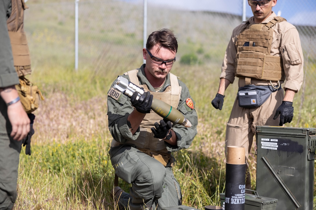 U.S. Marines with 7th Engineer Support Battalion, 1st Marine Logistics Group, unpackage a mortar round during an explosive ordnance disposal exploitation exercise, on Marine Corps Base Camp Pendleton, California, April 29, 2025