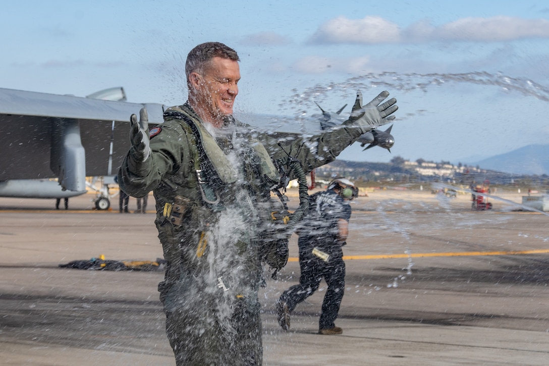 U.S. Marines with 3rd Marine Aircraft Wing celebrate Brig. Gen. Daniel B. Taylor, the assistant wing commander of 3rd Marine Aircraft Wing, following his final flight in an F/A-18D Hornet assigned to Marine Fighter Attack Squadron (VMFA) 323, Marine Aircraft Group 11, 3rd MAW, at Marine Corps Air Station Miramar, California, May 1, 2025.