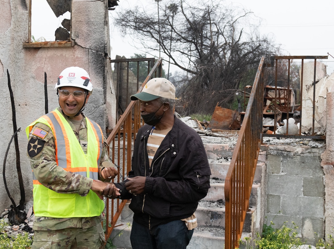 Col. Sonny Avichal, U.S. Army Corps of Engineers Emergency Field Office–Eaton commander presents a poker chip and decal to USACE employee Darius Wallace from the EFO-Eaton wildfire team.

USACE is working in partnership with local, state and the Federal Emergency Management Agency in response to the Southern California Wildfires.