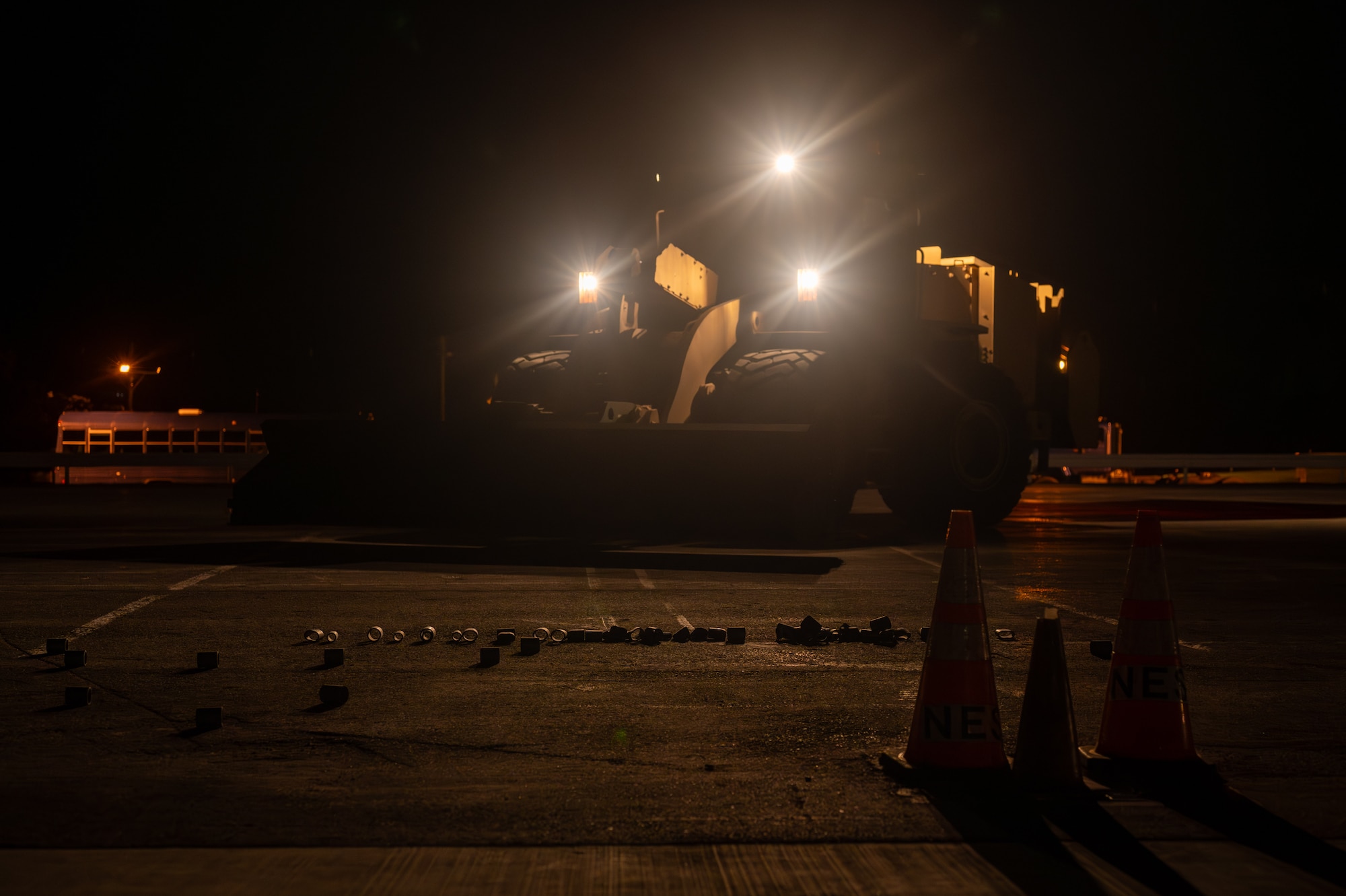 A front loader sweeps the runway.