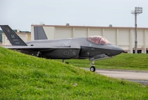 An aircraft taxis down the runway.