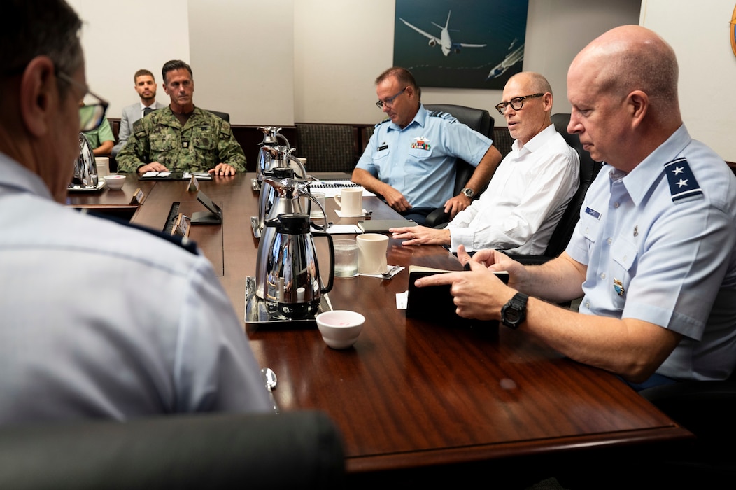 From right to center, U.S. Air Force Maj. Gen. Joel Carey,, chief of staff of U.S. Indo-Pacific Command, New Zealand Secretary of Defence Brook Barrington, and Chief of Defence Force Air Marshal Tony Davies, hold a group discussion at USINDOPACOM headquarters on Camp H. M. Smith in Honolulu, May 5, 2025.