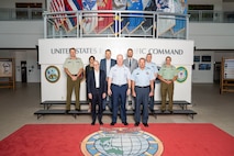 U.S. Air Force Maj. Gen. Joel Carey, front center, chief of staff of U.S. Indo-Pacific Command joins New Zealand Secretary of Defence Brook Barrington, front left, and Chief of Defence Force Air Marshal Tony Davies, front right, for a group photo at USINDOPACOM headquarters on Camp H. M. Smith in Honolulu, May 5, 2025.