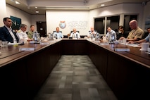 U.S. Air Force Maj. Gen. Joel Carey, center right, chief of staff of U.S. Indo-Pacific Command, New Zealand Secretary of Defence Brook Barrington, center, and Chief of Defence Force Air Marshal Tony Davies, center left, hold a group discussion at USINDOPACOM headquarters on Camp H. M. Smith in Honolulu, May 5, 2025.