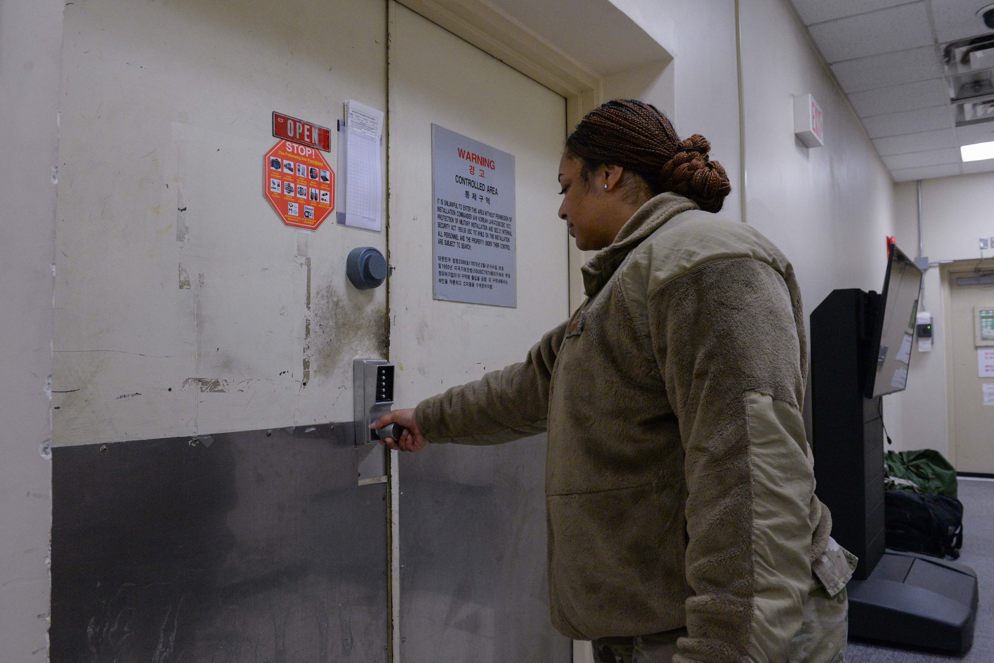 U.S. Air Force Staff Sgt. Kieara Obama, 51st Fighter Wing advanced programs office logistics manager, enters her workcenter at Osan Air Base, Republic of Korea, May 5, 2025. Obama was recognized as Mustang of the Week for her outstanding contributions to the APO mission. She also has arranged four professional development events for new non-commissioned officers across Osan. (U.S. Air Force photo by Staff Sgt. Kahdija Slaughter)