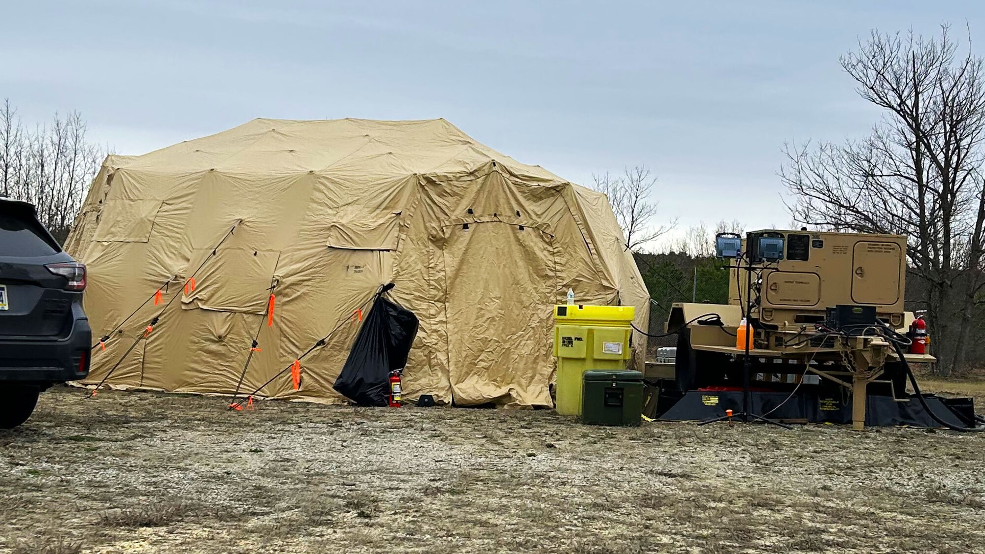 A team from the 258th Combat Airfield Operations Squadron use expeditionary sleeping quarters ahead of the delivery of the Mobile Special Navigational Aid-7 tower to reduce operational costs at Lakehurst’s Maxwell Field at Joint Base McGuire-Dix-Lakehurst, N.J., April 4, 2025. In a display of Total Force Integration, active-duty Airmen, Sailors and Air National Guard teams successfully deployed and activated the MSN-7 tower at Lakehurst’s Maxwell Field while the main tower underwent refurbishment allowing for uninterrupted support to mission readiness and operational capability. (U.S. Navy photo by Electronics Technician 1st Class Dariel Cruz)
