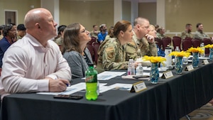 people sitting at desk.