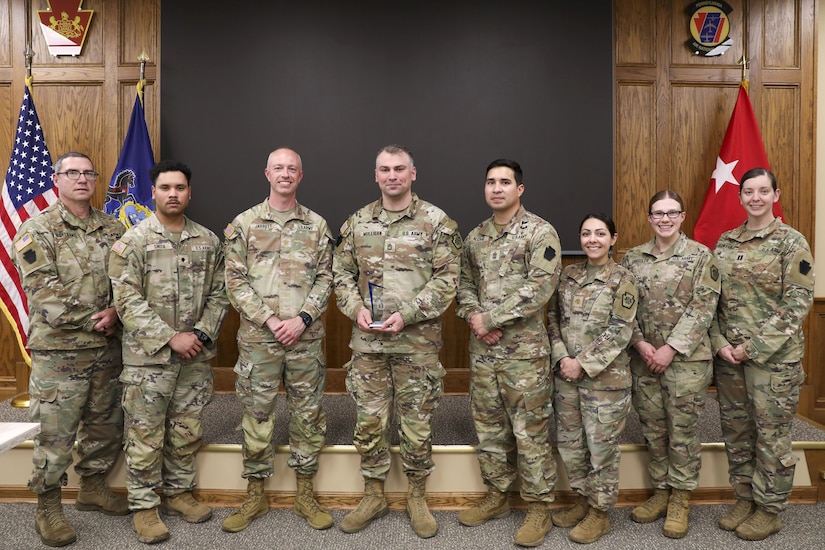Sgt. 1st Class Denis Mulligan, fourth from left, Health Services and Support Branch Chief with the Pa. Guard’s G1 Services Division, was recently recognized as the Army National Guard medical readiness noncommissioned officer of the year for large states. The award is intended to recognize a medical readiness NCO who has demonstrated excellence in their position by contributing to high levels of medical readiness while serving. (U.S. Army National Guard photo by Sgt. 1st Class Zane Craig)