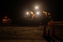 A front loader sweeps the runway.