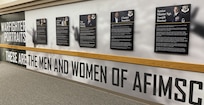 Photo of the AFIMSC Portraits displayed in the hallway of AFIMSC HQ.