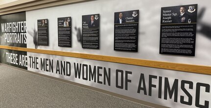 Photo of the AFIMSC Portraits displayed in the hallway of AFIMSC HQ.