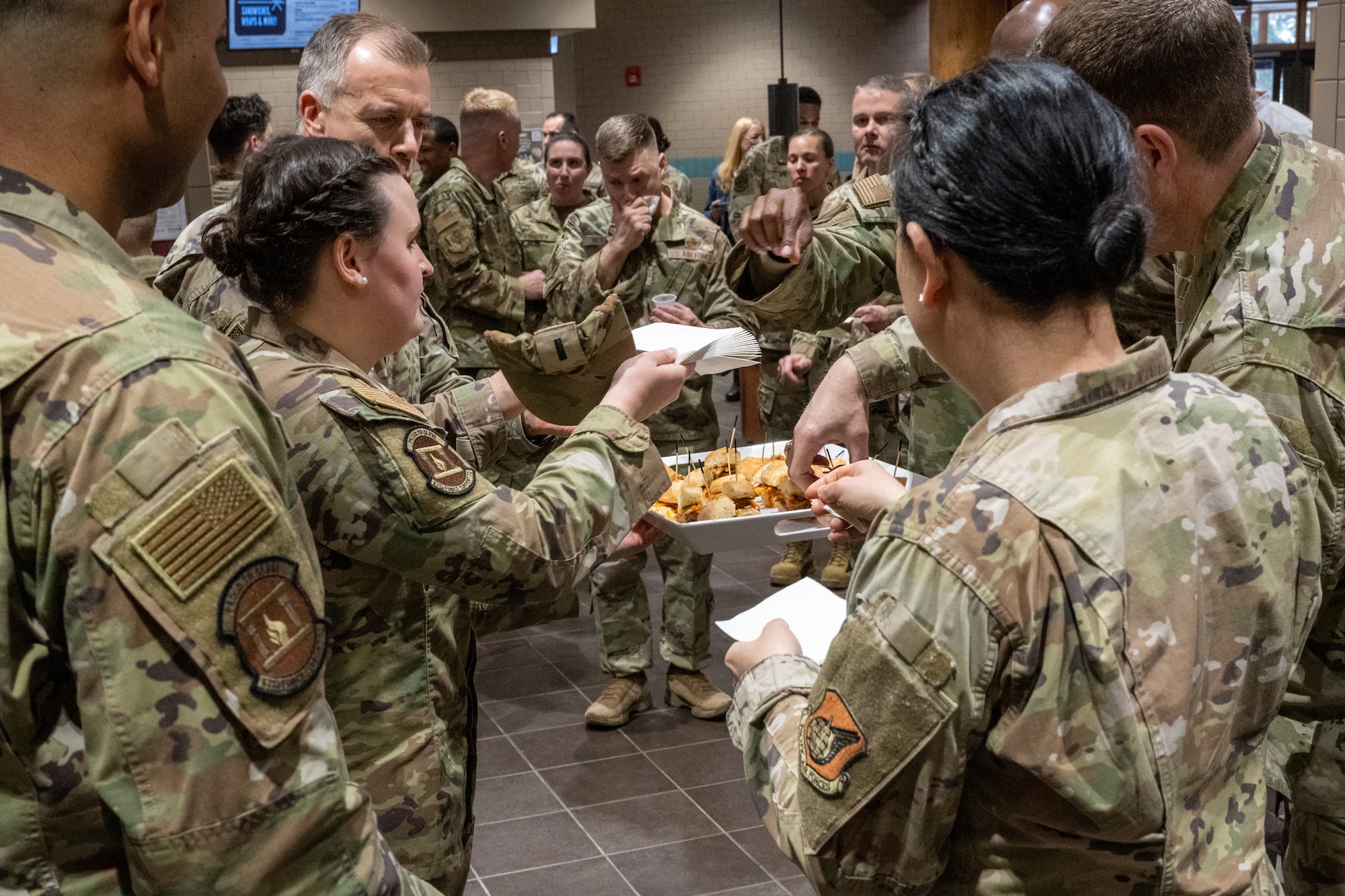 Senior leaders of Joint Base Elmendorf-Richardson, Alaska, sample new food items during the reopening ceremony of the Iditarod Dining Facility at JBER, May 5.