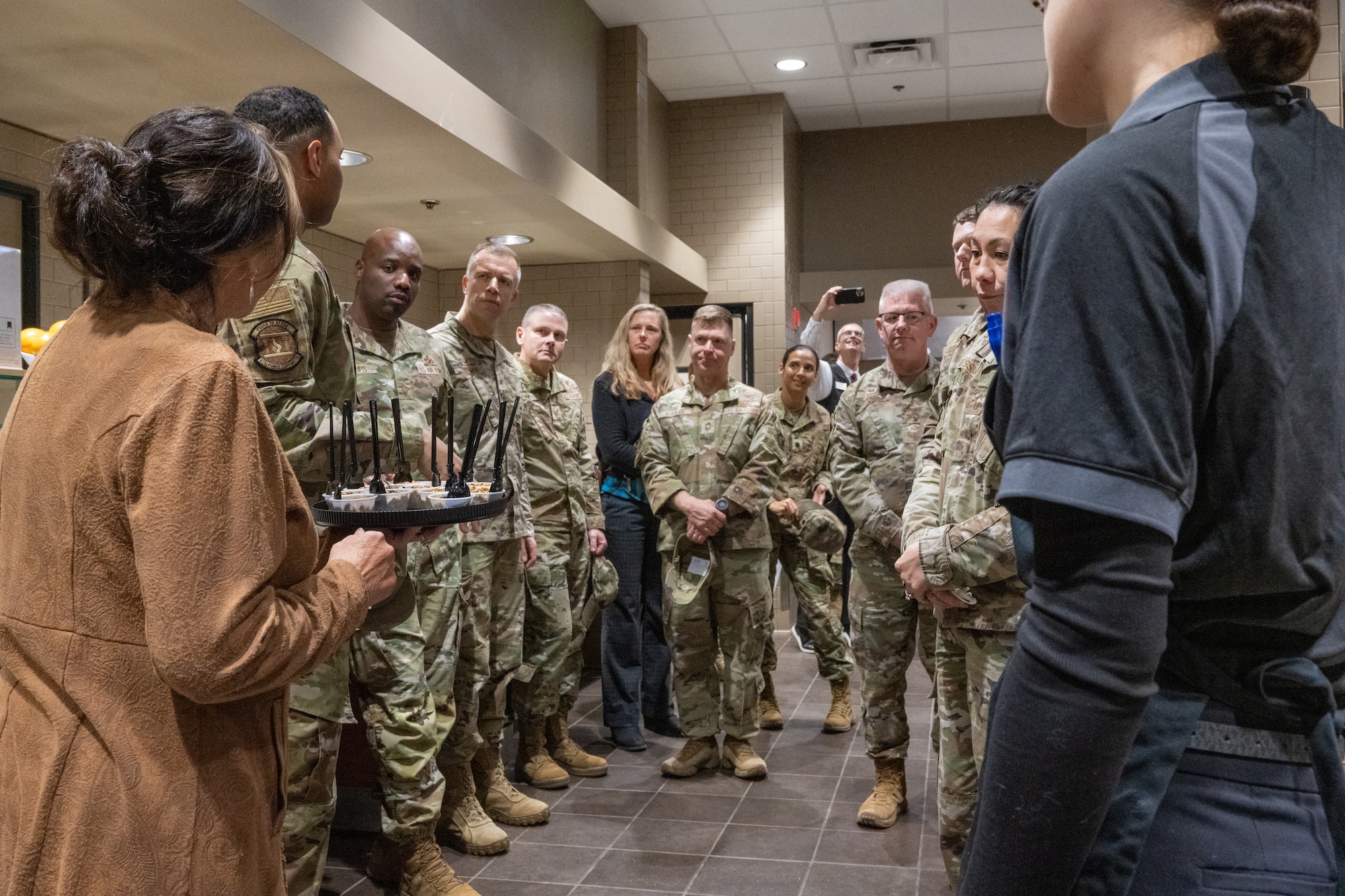 U.S. Air Force Staff Sgt. James Martin, storeroom noncommissioned officer in charge assigned to the 673d Force Support Squadron, leads senior leaders of Joint Base Elmendorf-Richardson, Alaska, on a tour of the renovated Iditarod Dining Facility, May 5.