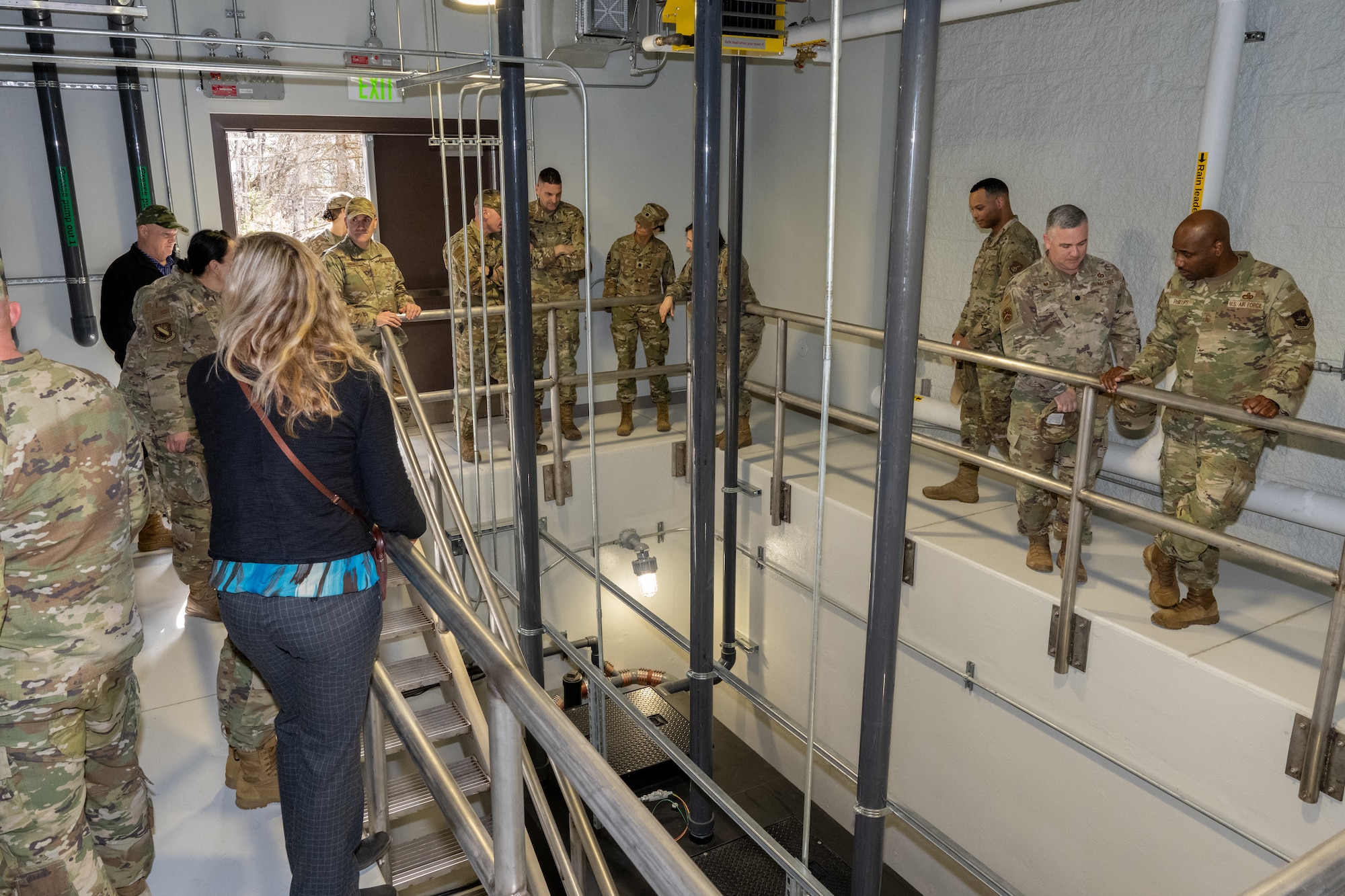 Senior leaders of Joint Base Elmendorf-Richardson, Alaska, view a newly installed grease trap at the Iditarod Dining Facility, May 5.