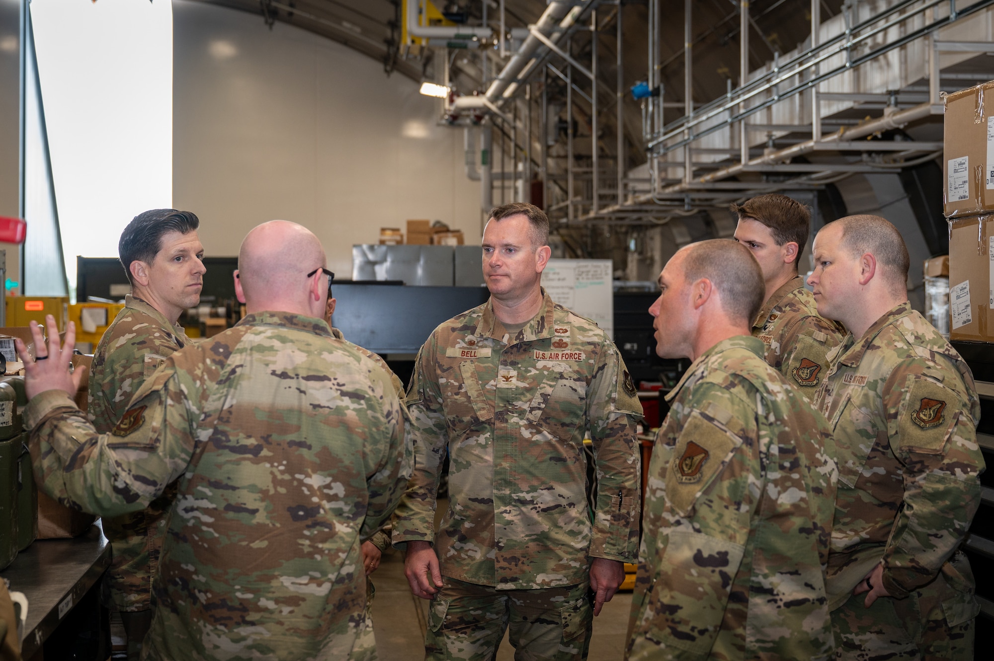 U S Air Force Colonel Jonathan Bell, 35th Mission Support Group commander, listens to members assigned to the 13th Fighter Generation Squadron during a Wild Weasel Walk through at Misawa Air Base, Japan.