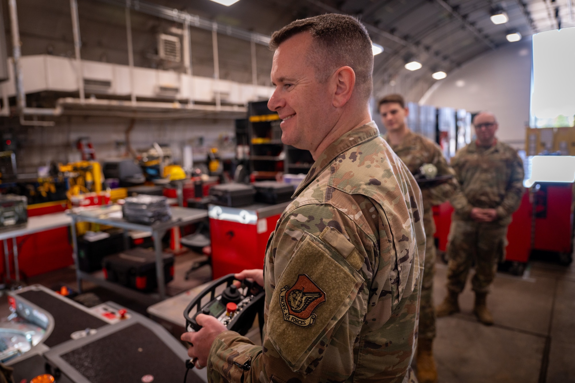 U S Air Force Colonel Jonathan Bell, 35th Mission Support Group commander, uses a controller during a Wild Weasel Walk through at Misawa Air Base, Japan