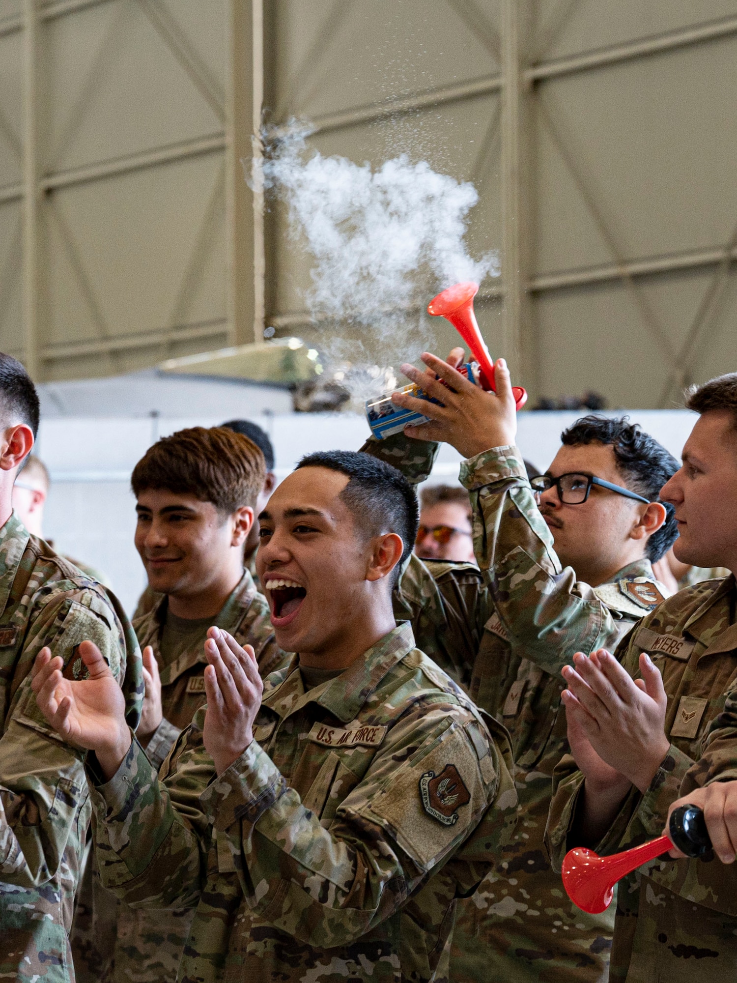 Service members cheer for newly appointed dedicated crew chiefs