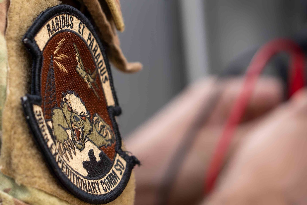 The 386th ECES patch is in the foreground of the photo, everything else is out of focus