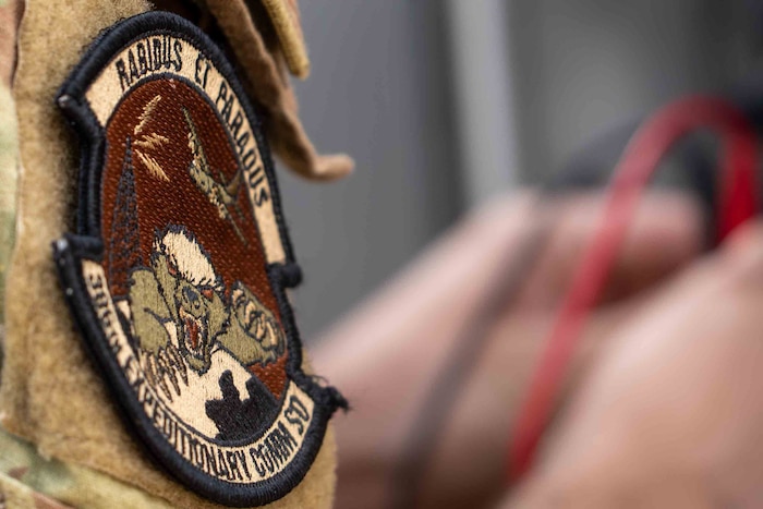 The 386th ECES patch is in the foreground of the photo, everything else is out of focus