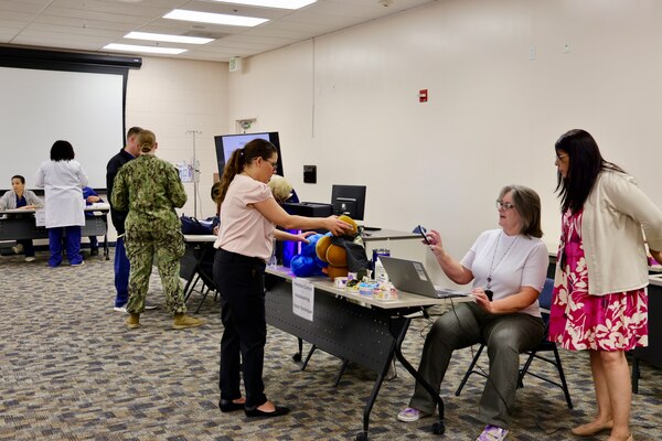 Hospital nurses and corpsmen assigned to Navy Medicine Readiness and Training Command (NMRTC) Twentynine Palms participate in hands-on training during the Annual Nursing and Corpsmen Skills Fair, held April 29–30. The two-day event focused on sharpening essential medical skills such as blood administration, high-level disinfection, suicide screening, and medication delivery using newly upgraded Alaris infusion pumps. Designed in response to regulatory standards and command-wide data trends, the fair emphasized readiness, patient safety, and teamwork through simulation-based learning and collaborative training sessions. The training ensures that Navy medical personnel remain highly skilled, adaptable, and prepared to deliver high-quality care in both military treatment facilities and deployed environments (U.S. Navy photo by Christopher C. Jones, NHTP/NMRTC Twentynine Palms public affairs officer).