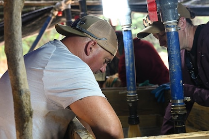 Oregon Army National Guard Sgt. 1st Class Nate Brushe, a recovery noncommissioned officer, wet-screens material during a Defense POW/MIA Accounting Agency (DPAA) recovery mission in Vietnam, April 11, 2025.