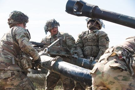 U.S. Soldiers assigned to 1st Battalion, 320th Field Artillery Regiment, 2nd Brigade Combat Team, 101st Airborne Division, set up the Howitzer M119A3 during their Table V certifications at Mihail Kogălniceanu Air Base, Romania, May 1, 2025. This training exercise serves as a way to improve standard operating procedures, which overall increases the warfighting capabilities of U.S. Soldiers allowing them to deploy, engage, and destroy enemies of the United States of America on any battlefield. (U.S. Army photo by Spc. Nathan Arellano Tlaczani)