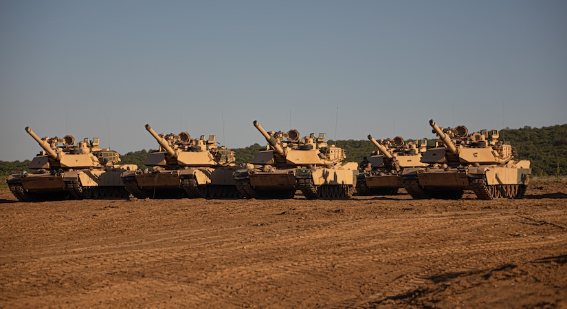 U.S. Army M1 Abrams belonging to 4th Battalion, 6th Infantry Regiment, 3rd Armored Brigade Combat Team, 1st Armored Division, wait in position in the area of operations to assist in the platoon situational training exercise at Novo Selo Training Area, Bulgaria, May 2, 2025. 1st Armored Division, a rotational force supporting V Corps, uses platoon situational training exercises to improve readiness and work alongside NATO Allies to enforce regional security as a combat-credible force. (U.S. Army Photo by Spc. Rayonne Bissant)