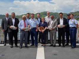 International partners from Papua New Guinea, the Solomon Islands, Indonesia, New Zealand, the United Nations, the European Union and the United States, stand on the flight deck of the Coast Guard Cutter Midgett (WMSL 757) in Port Moresby, Papua New Guinea Mar. 6, 2025. The Coast Guard supports deepening and expanding its relationship with Pacific Islands nations. The United States and Papua New Guinea share a relationship that is based on trust and mutual interests, with our long history of defense partnerships, commercial links, and people-to-people ties.