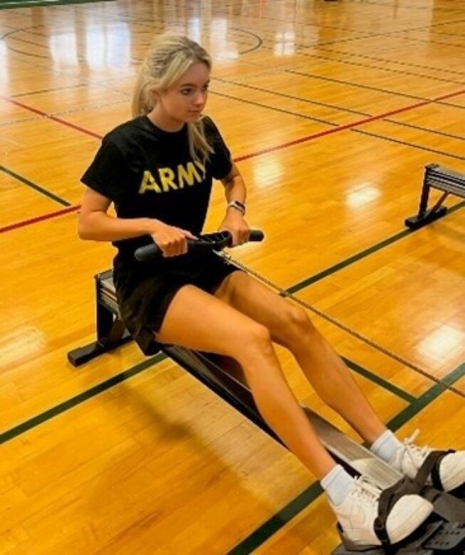 Spc. Prudence Pingrey rows at the JBLM SRU gym as part of her adaptive reconditioning.