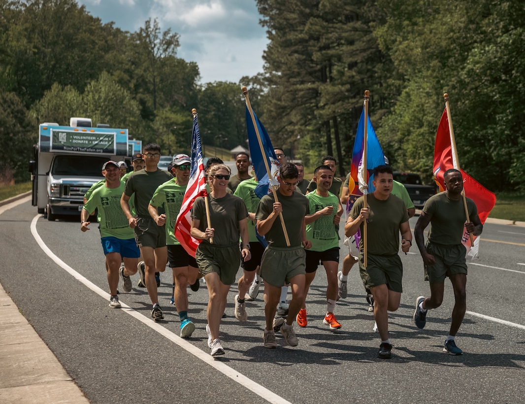 U.S. Marines and volunteers run during the Virginia Run for the Fallen event at Marine Corps Base Quantico, Virginia, May 3, 2024.  The Virginia Run for the Fallen is an organized tribute event to run specific miles for every Virginia Fallen Service Member who died as a result of serving from any circumstance during the War on Terror. (U.S. Marine Corps photo by Lance Cpl. Ethan Miller)