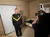 Lt. Col. John Hutka gets his bio book headshot taken for the 2025 Army Trials.