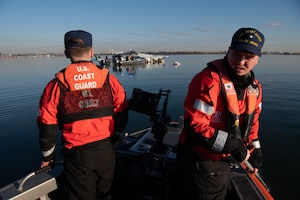 U.S. Coast Guard Petty Officer 2nd Class Lance Ide, left, and Petty Officer 3rd Class Corbin Singleton, boatswain’s mates at Station St. Inigoes, respond to the aircraft collision on the Potomac River, Washington, January 30, 2025. The Coast Guard responded to the incident with local, city, state and federal partners. (U.S. Coast Guard photo by Petty Officer 3rd Class Christopher Bokum)