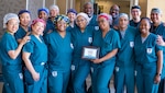 Members of the  Alexander T. Augusta Military Medical Center (ATAMMC) Perioperative Nursing Staff take a moment to announce it has earned the prestigious Certified Perioperative Nurse (CNOR®) designation from the Competency & Credentialing Institute (CCI). It is a significant