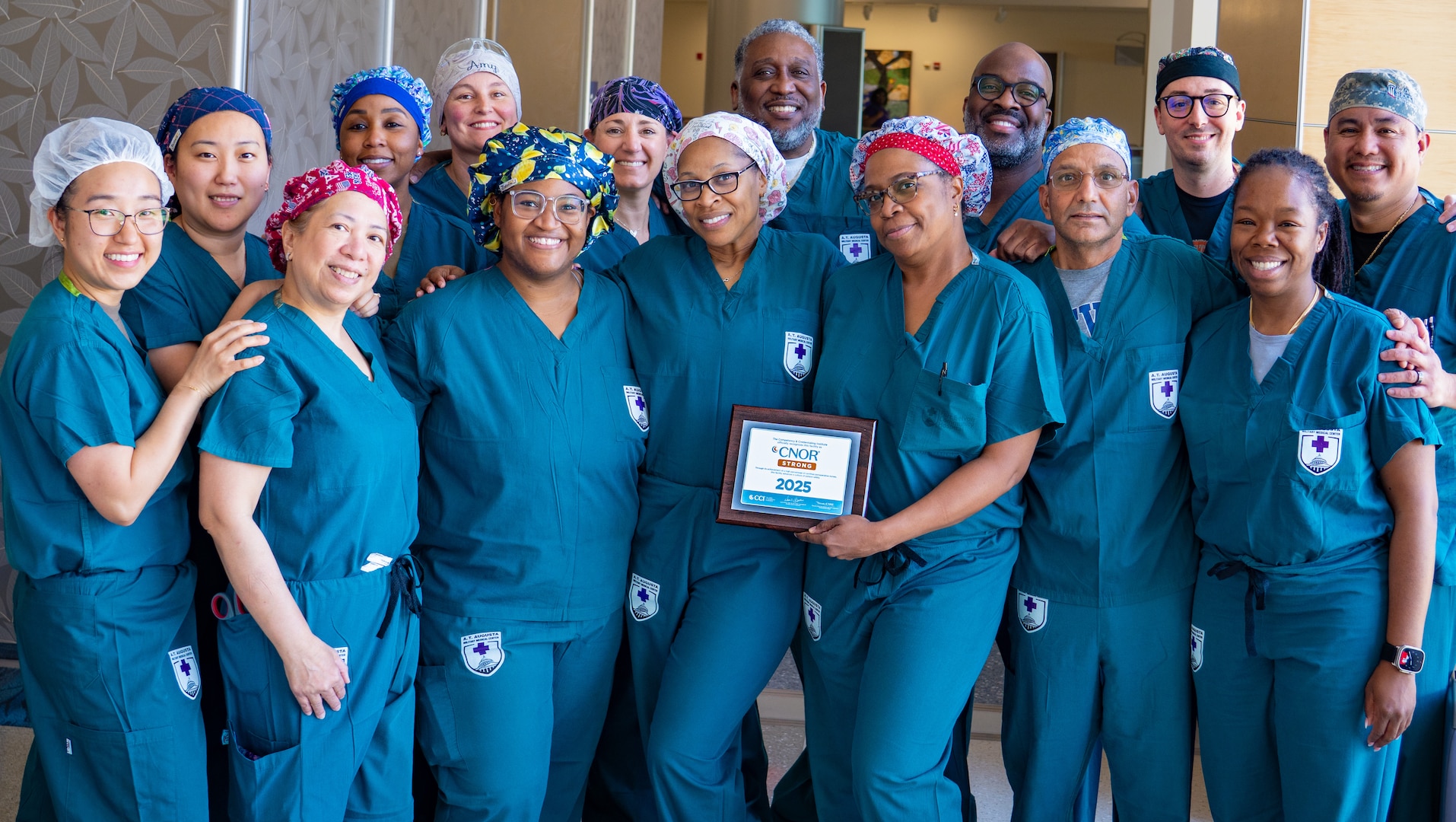 Members of the  Alexander T. Augusta Military Medical Center (ATAMMC) Perioperative Nursing Staff take a moment to announce it has earned the prestigious Certified Perioperative Nurse (CNOR®) designation from the Competency & Credentialing Institute (CCI). It is a significant