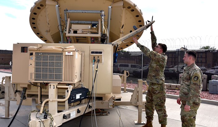 Army space professionals celebrate National Space Day on May 2 to recognize how they live and work every day. Spc. Klay Walker and Spc. Alexander Best with the 4th Space Company, 1st Space Battalion, work on a Mobile Integrated Ground Suite at Fort Carson, Colorado. The 1st Space Brigade recently conducted an expeditionary maneuver of transportable systems across combatant command areas of responsibility, demonstrating to allies and partners the readiness of the brigade and its subordinate units to deploy rapidly around the globe. (U.S. Army Photo by Dottie White)