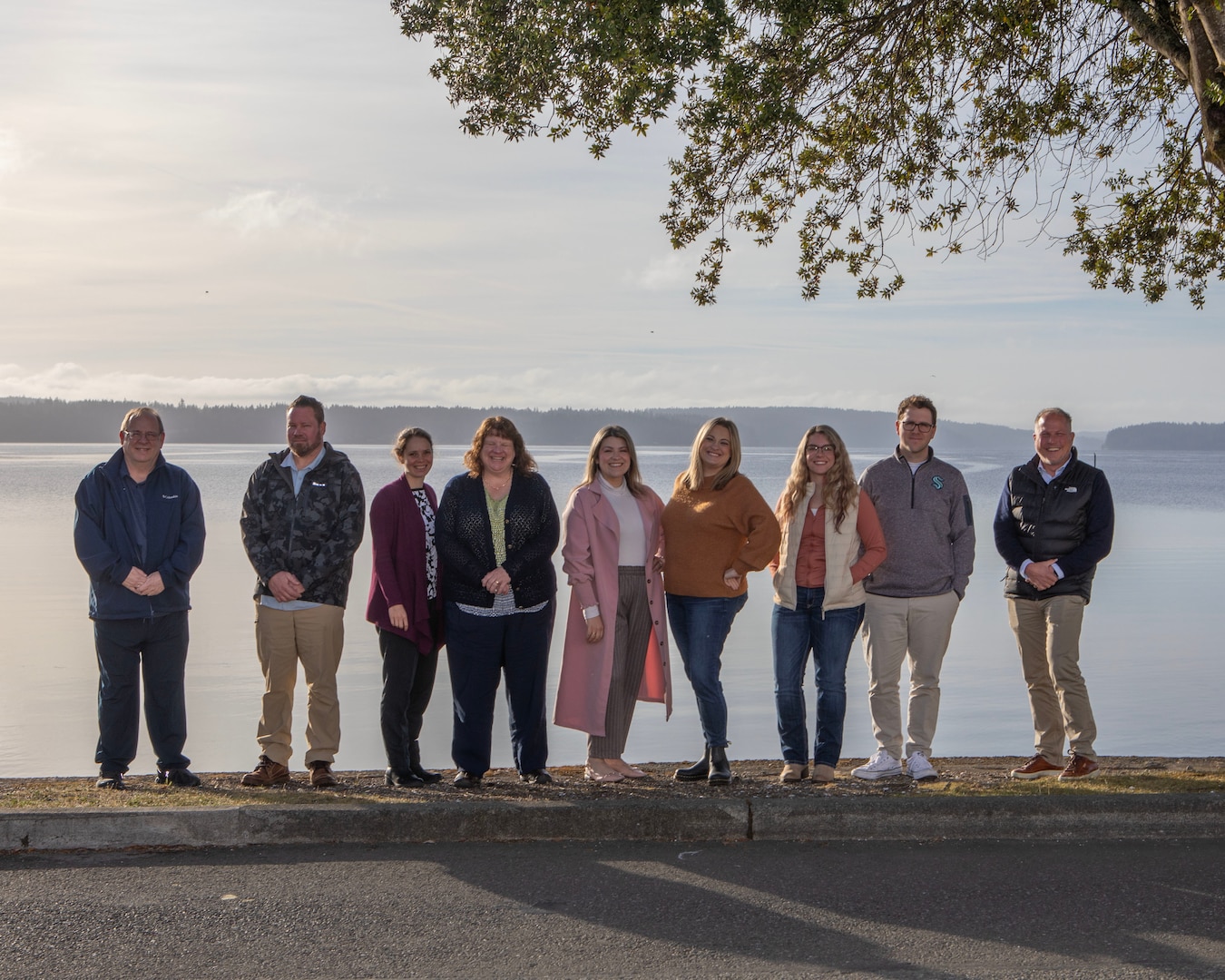 The team that streamlined the DD254 process at Naval Undersea Warfare Center Division, Keyport gathers after a successful outbrief. Not pictured are NUWC Division, Keyport employees Lonny Schmitt and Michael Beadle and Naval Sea Logistics Center employees Indiana Bolger, Laurel Imes and Michael DeMedici. (U.S. Navy photo by Scott Pittman/Released)