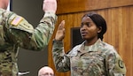 Juliana Nkafu takes the Oath of Office and commissions as a Illinois Army National Guard and U.S. Army second lieutenant during her April 26 commissioning ceremony.