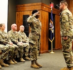 2nd Lt. Juliana Nkafu returns the salute of Sgt. 1st Class Paul Golladay as part of her commissioning ceremony.