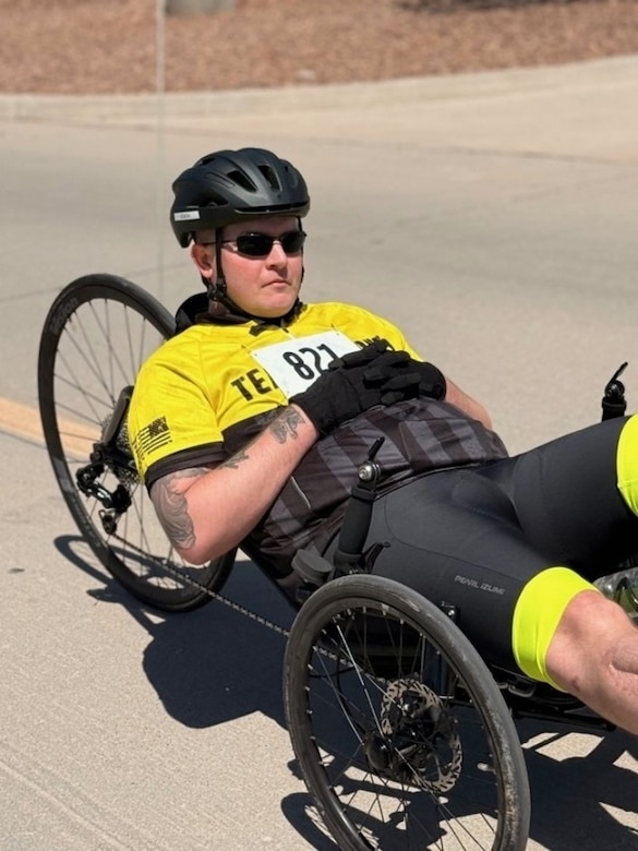 Sgt. Kyle Fields prepares to compete in timed trials for cycling on a recumbent bike at the 2025 Army Trials.